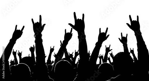 Silhouette of a Crowd with Raised Hands and Rock and Roll Gesture at a Concert