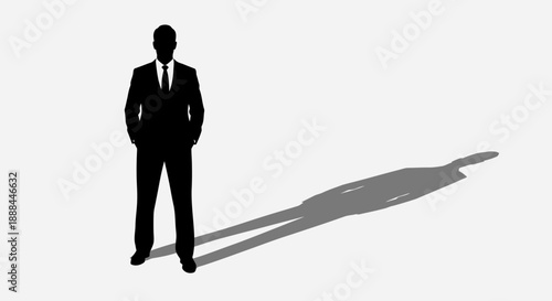 Confident Silhouette of a Businessman in a Suit Standing with His Shadow
