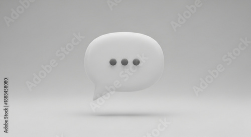 White speech bubble with three dots on a gray background symbolizing pause or conversation