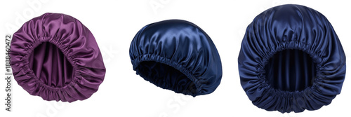 Photos Set of luxury satin silk sleep bonnets for hair protection, purple and navy blue elastic night caps isolated on white background for beauty and hair care