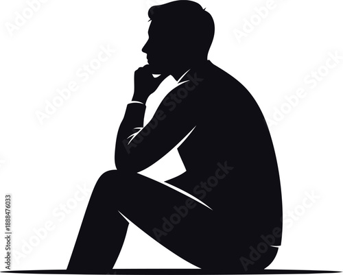 Silhouette of a man in profile sitting with chin resting on hand