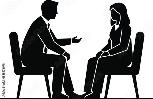Two people in silhouette sitting on chairs talking