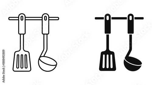 Kitchen utensils hanging on a rail