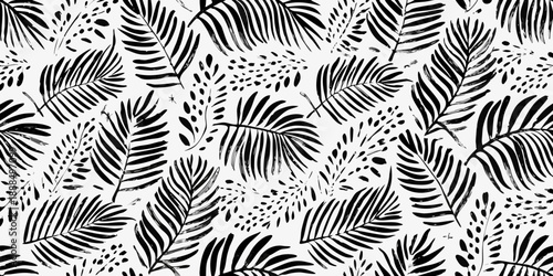 Black and white tropical leaf pattern with scattered spots