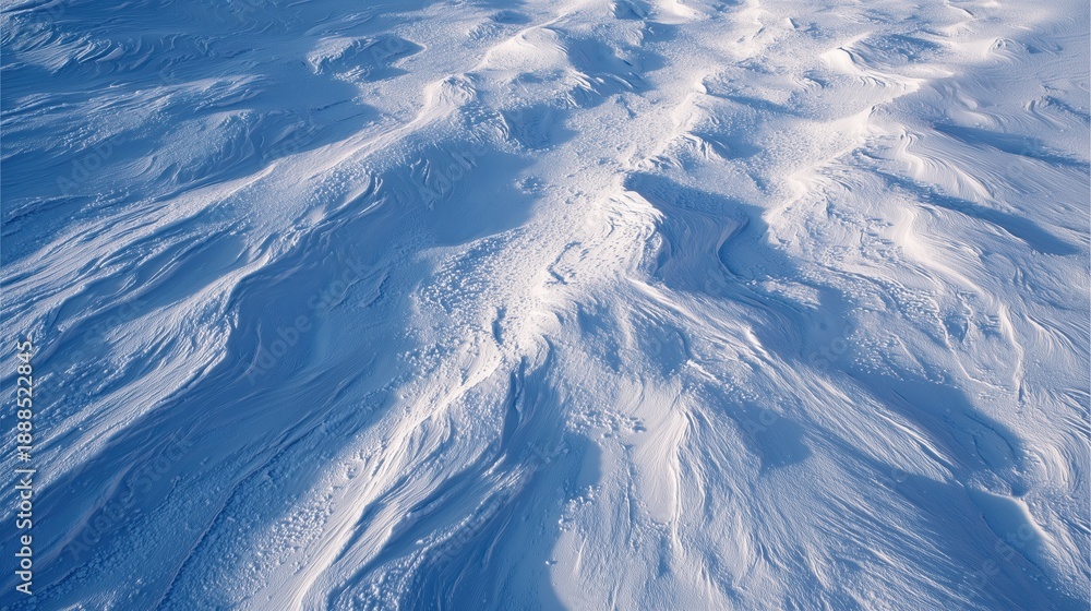 Fototapeta premium Snow-Covered Landscape: An aerial perspective captures the abstract beauty of a snow-laden landscape. The pristine white surface, sculpted by the elements.
