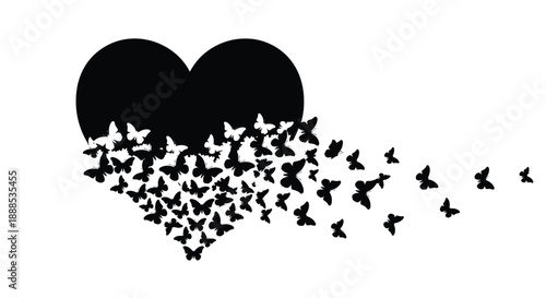 A heart shape formed by flying butterflies a dark silhouette
