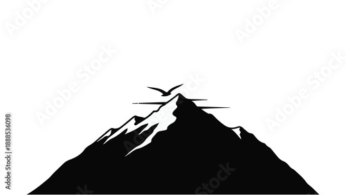 Majestic mountain peak with a bird soaring against a clear sky, symbolizing freedom and achievement.