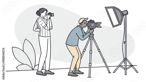 Two photographers capturing moments in a studio setting.