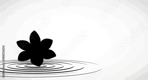 Elegant minimal black and white image of a flower creating ripple on water surface