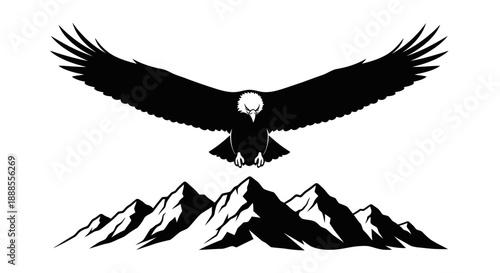 Majestic eagle soars above snow capped mountains in black and white silhouette