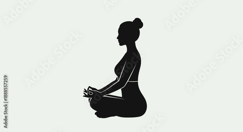 Silhouette of a woman meditating in lotus position for wellness and relaxation practice with