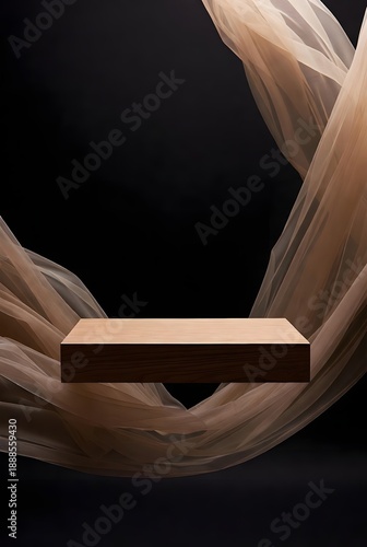 Refined wooden pedestal floating gracefully with an ethereal sheer fabric creating a captivating backdrop, ideal for elegant product display and visual marketing