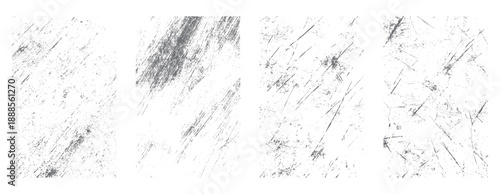 Four grey distressed grunge textures with scratches and speckles on white background