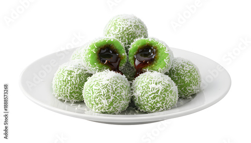 Plate of green mochi balls covered in shredded coconut with sweet filling.