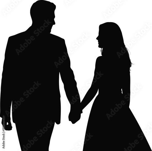 Man and woman dressed formally hold hands walking together in silhouette