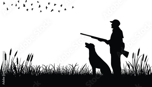 A dedicated hunter and his faithful dog stand amidst marsh grass as a group of birds flies past
