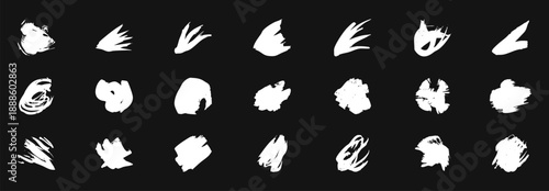 White paint splatter and brush stroke marks on a black background. Abstract grunge ink blots, splashes, and rough paint textures with dynamic motion. Perfect for overlays, posters, street art designs,