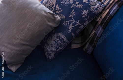 Pillows on the sofa with lights off