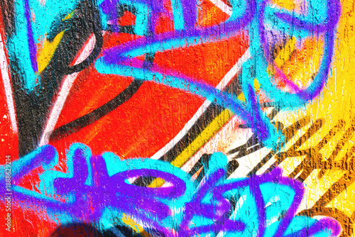 Bright graffiti wall - red, blue, yellow, purple spray paint lines, urban street art style. 90s, Y2K trend, fluorescent colors. Digital art, posters, background, creative banners, street visuals.