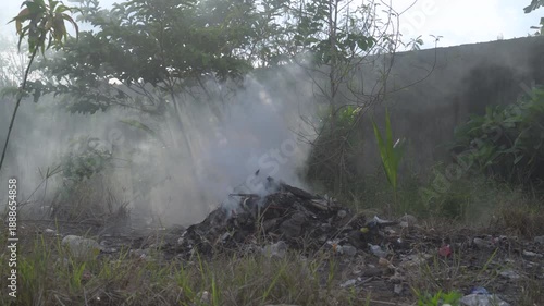 Close-Up of Trash Burning Producing Thick Smoke in Outdoor Rural Area