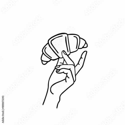 the hand holds a croissant. icon
