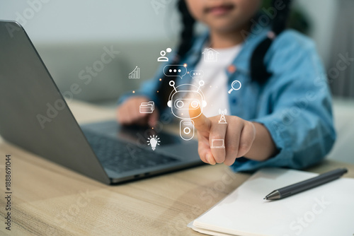 Young girl interacting with AI chatbot icon on laptop. Child using artificial intelligence for smart learning, digital communication, and future technology education at home.