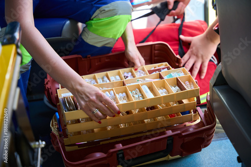 Fotografía Female paramedic preparing medical kit inside ambulance