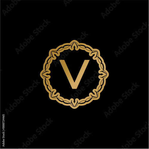 Elegant golden letter V monogram logo design with ornate filigree frame on a dark background, showcasing a luxurious and classic vector art illustration suitable for branding and upscale projects