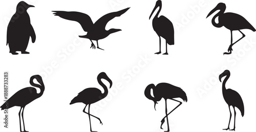 A striking black silhouette of a flamingo standing in profile view