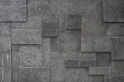Schilderij op canvas Texture of grey natural stone wall cladding with a geometric rectangular pattern, offering a modern architectural background