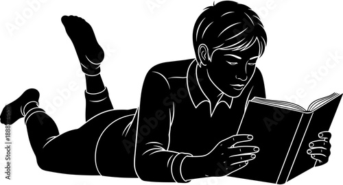 Black silhouette illustration of a young boy lying down on his stomach while focused on reading an open book intently