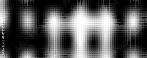 Grunge halftone gradient background. Faded grit noise texture. White and black sand wallpaper.