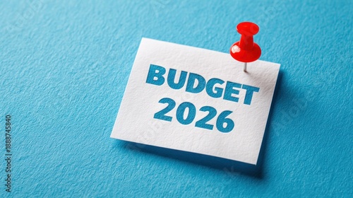 Budget 2026 note pinned on blue surface