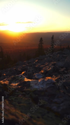 Epic vertical travel video: dramatic mountain landscape at golden sunset, vibrant autumn hues, breathtaking natural scenery. Perfect for travel content.