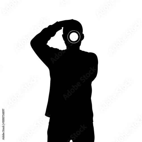 Man holding camera to face while posing in silhouette for photographer  