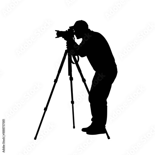 Photographer taking a picture with camera on tripod silhouette  