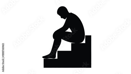 Silhouette of a man sitting alone and looking down expressing deep sadness loneliness or disappointment on steps