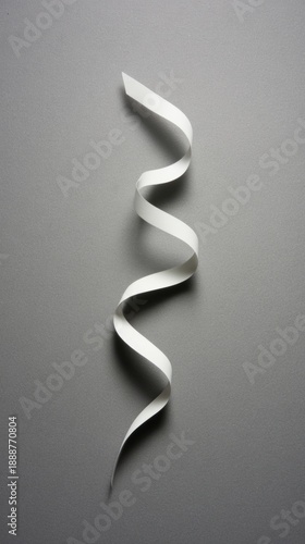 drape. A white ribbon curving downward against a minimalist gray background. wellbeing guides, coaching materials, designed for mental health education and mindfulness programs, clarifies learning.
