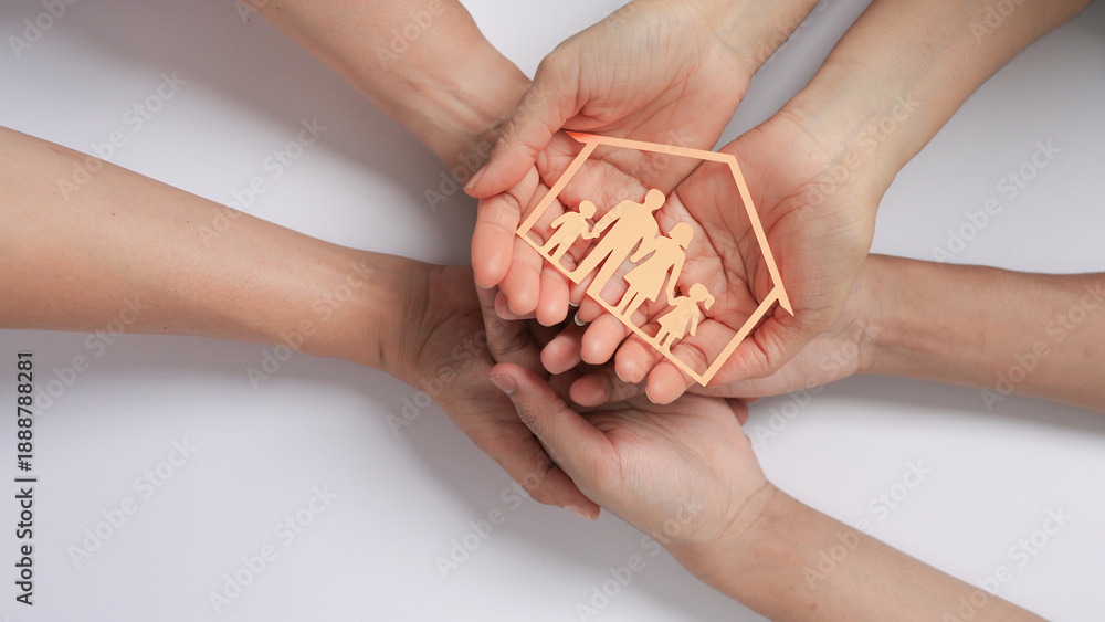 © Piya W. - Family  holding inclusive house icon showing love and care with family support concept on white background symbolizing safety
