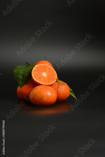 Organic tangerines with leaves. Health concept promoting natural vitamins, immunity, and clean eating.