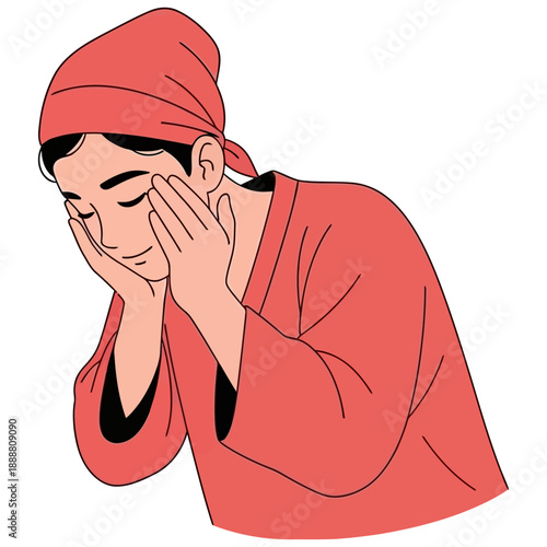 Person wearing a red head covering and robe washing their face with both hands eyes closed in a serene expression face washing hygiene personal care skincare