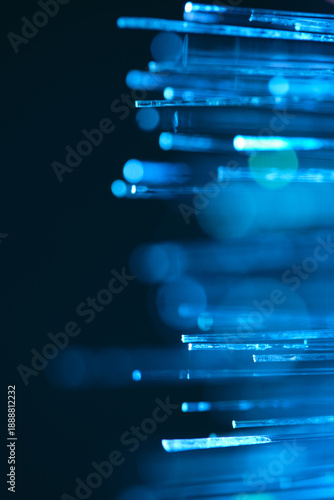 Blue optical fibers close up abstract background. Shallow depth field.