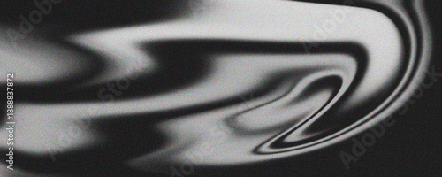 Monochromatic abstract flowing pattern in shades of grey and white, grainy texture