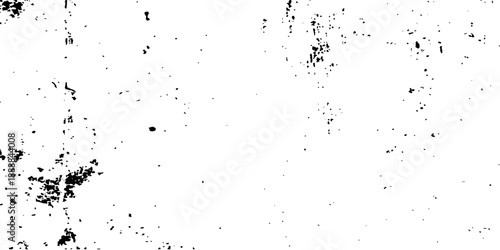 Abstract grunge background featuring a black ink splat with liquid paint splashes and water droplets creating a dirty textured pattern on paper