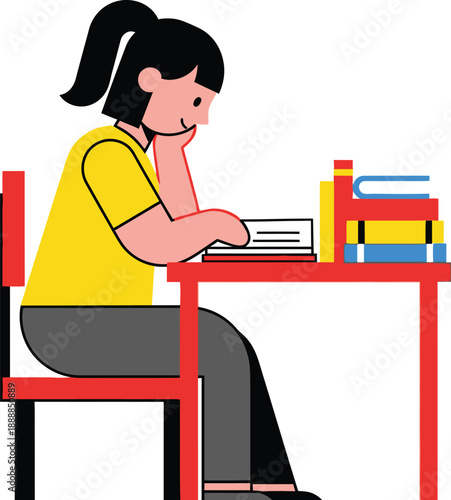 Female student sitting sideways at a red desk while reading an open book next to a stack of textbooks.