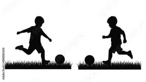 Two boys playing with a ball on grass a striking silhouette