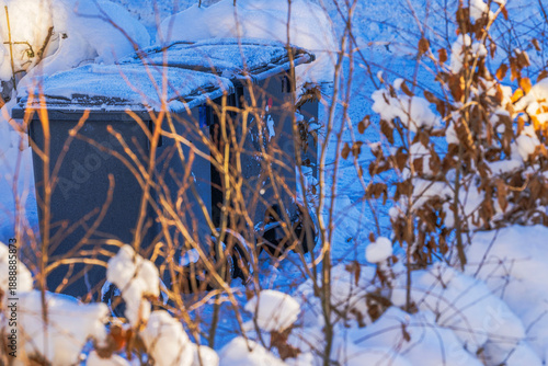 Wallpaper Mural Close up view of two snow covered waste bins for garbage sorting in villa garden during winter. Sweden. Torontodigital.ca