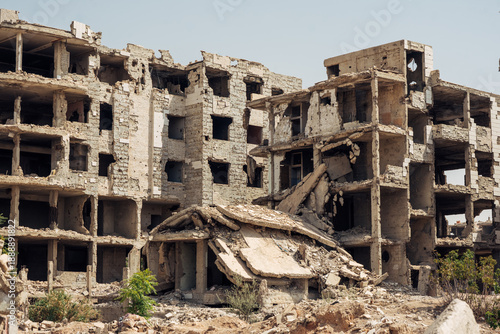 Bilde på lerret Collapsed and heavily damaged apartment buildings in Jobar, Damascus, showing destruction from the Syrian Civil War