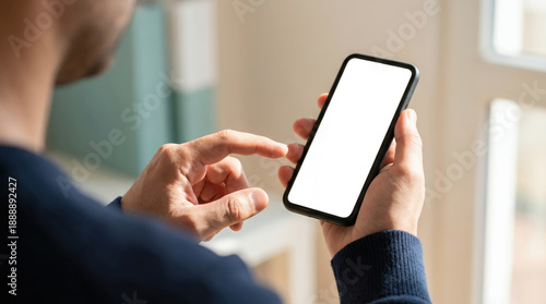Close up of a man's hands holding and interacting with a smartphone focusing on the screen display mobile phone finger touch screen technology digital communication