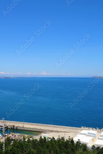 High angle view of Waian Fishing Port with turquoise ocean and blue sky in Penghu, Taiwan.